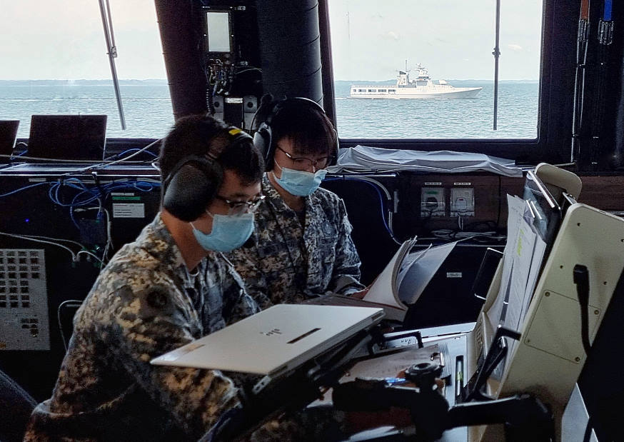 RSS Fearless' Communication System Operators hard at work during the publication exercise (PUBEX) serial. This requires both ships' operators to refer to common communication publications and tests their ability to respond efficiently and accurately.