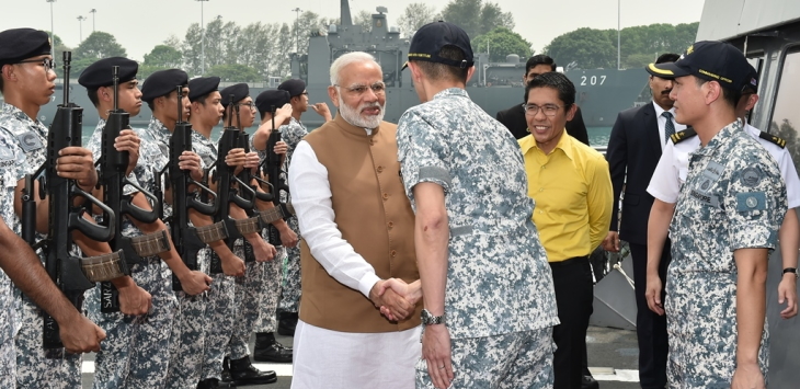 Indian Prime Minister Narendra Modi accompanied by Senior Minister of State for Defence Dr Mohamad Maliki Bin Osman, being welcomed on board the Republic of Singapore Navy (RSN)