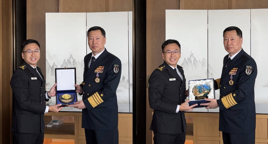 While in Qingdao, RADM Wat (left) met with People's Liberation Army (Navy) Commander VADM Hu Zhongming (right).