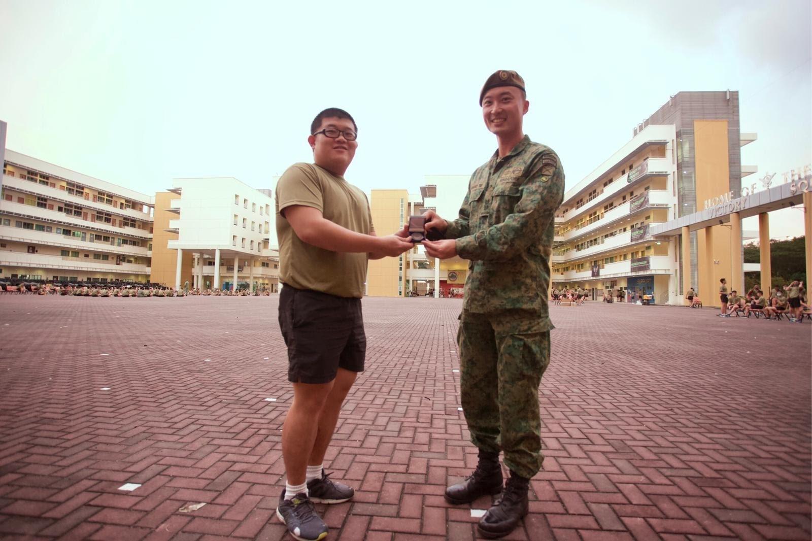 LCP Kwok receiving the CO coin from his CO, LTC Bernard Tay (photo was taken before Circuit Breaker measures).