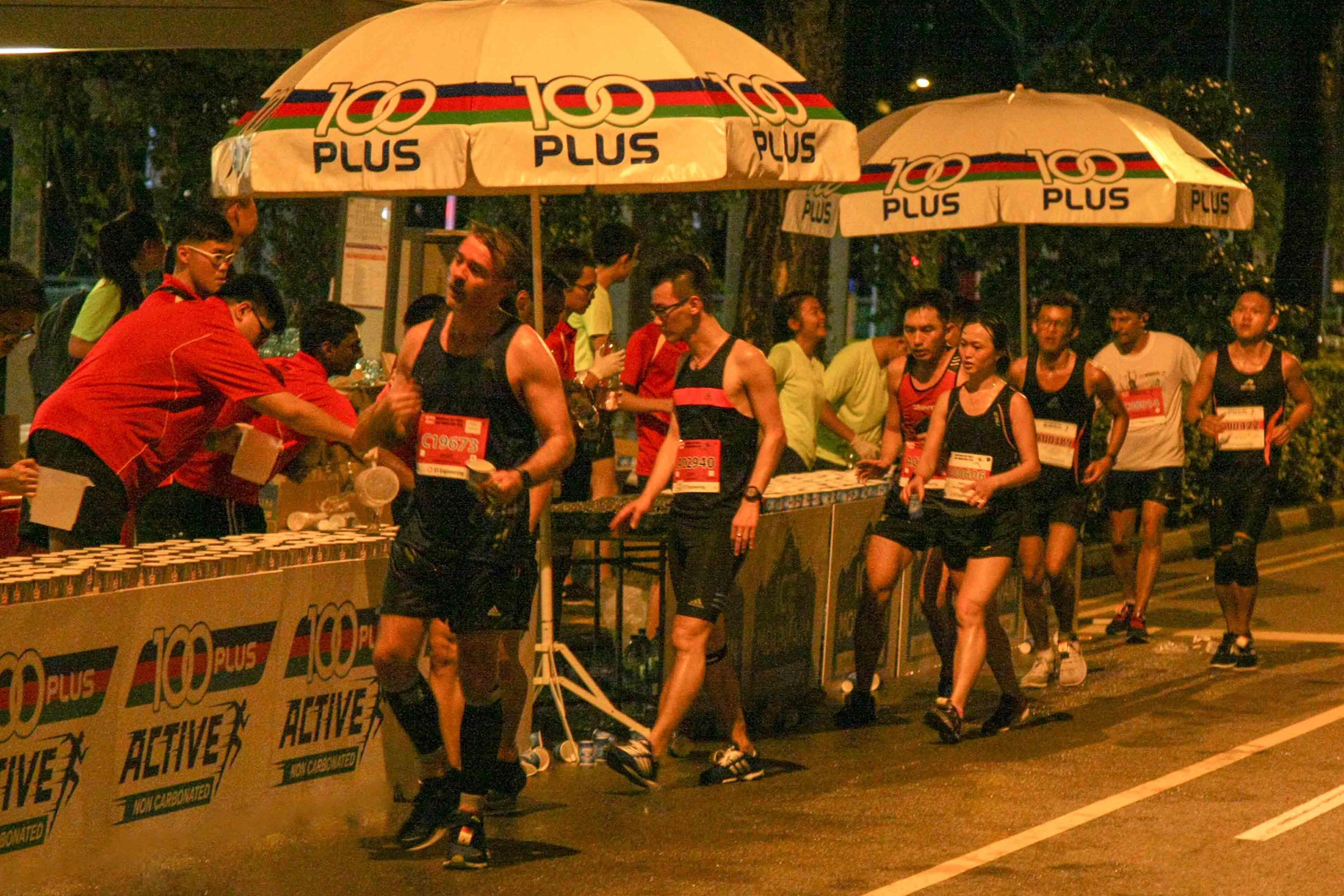 Runners hydrating themselves at the water point.
