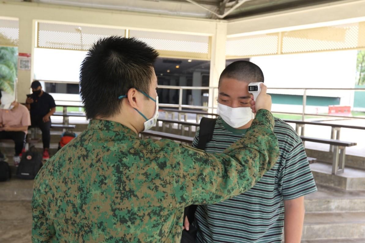Enlistee having his temperature screened.