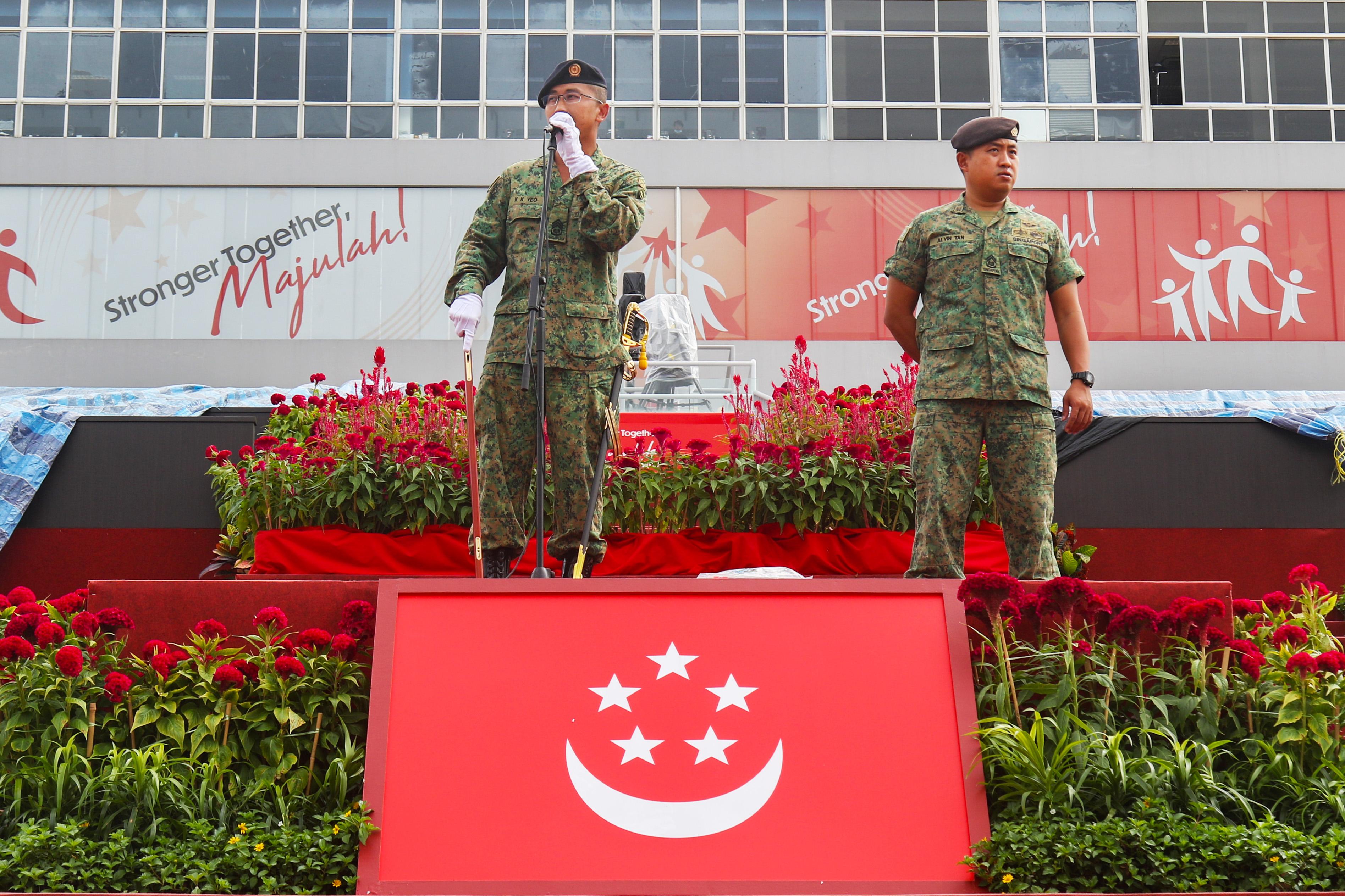 MWO Yeo (left) and 1WO Alvin Tan, ensuring that the NDP22 Parade & Ceremony (P&C) runs smoothly.