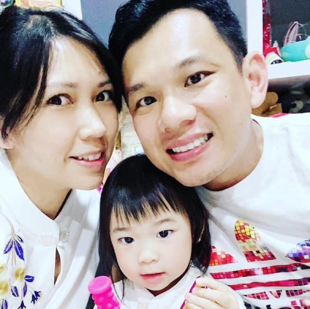Their little family: MAJ Lee (left) and MAJ Ang (right) with their daughter (centre).