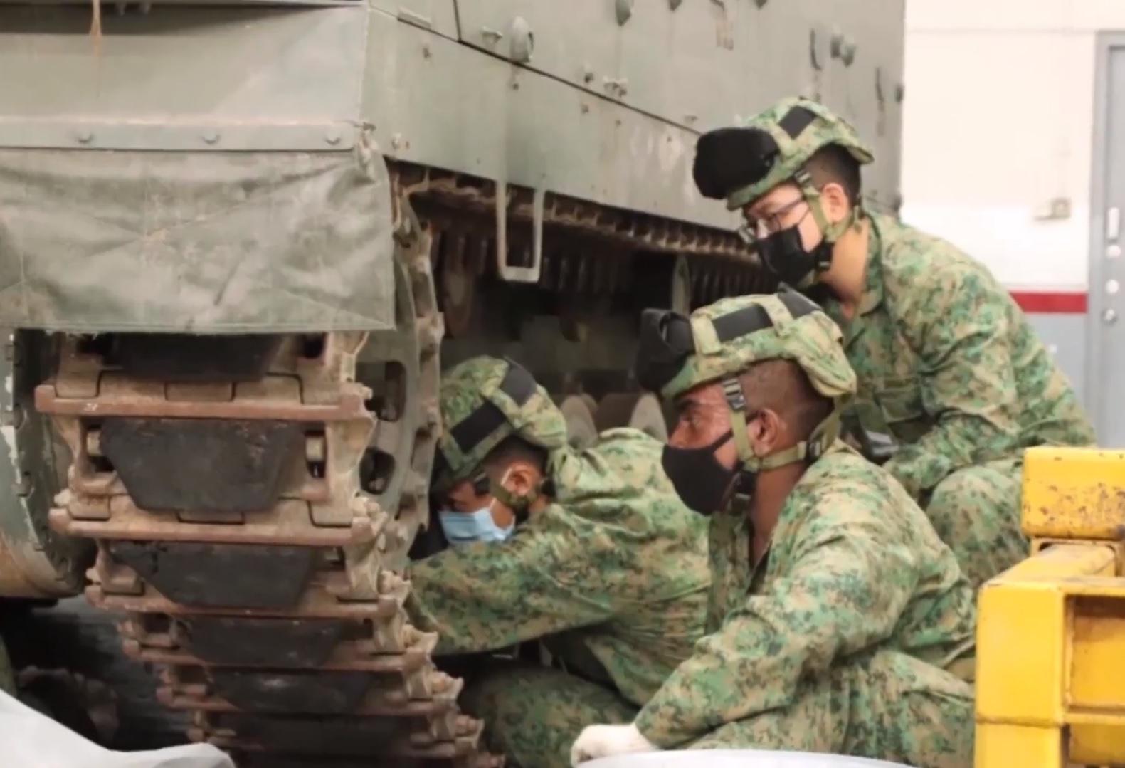 Armour Specialist Cadets performing operational checks on the Bionix Infantry Fighting Vehicle.