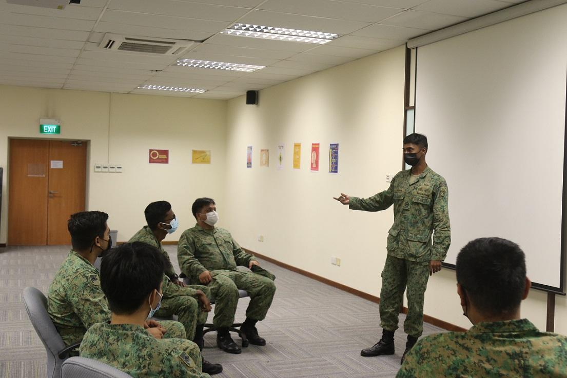 2WO Pandian Selvam engaging his trainees before their outfield exercise, ensuring they understand the mission objective.