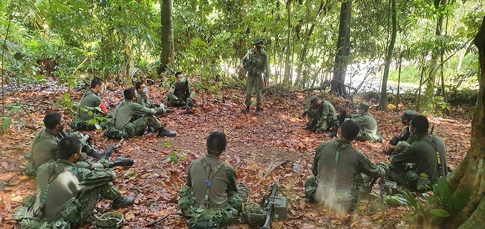 SSG Varun Dass (middle) debriefing his trainees to ensure that they have understood the objective of the outfield exercise.