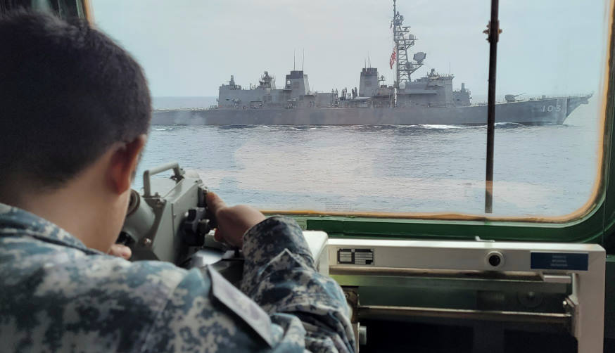 A bridge lookout from RSS Tenacious to take bearing of JS Yudachi during the manoeuvring exercise.