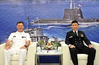 Chief of Staff - Naval Staff (COS-NS) of Republic of Singapore Navy Rear Admiral (RADM) Augustine Lim (right) with Strategic Advisor to the Chief of Belgium Navy Rear Admiral (RADM) Carl Gillis (left)