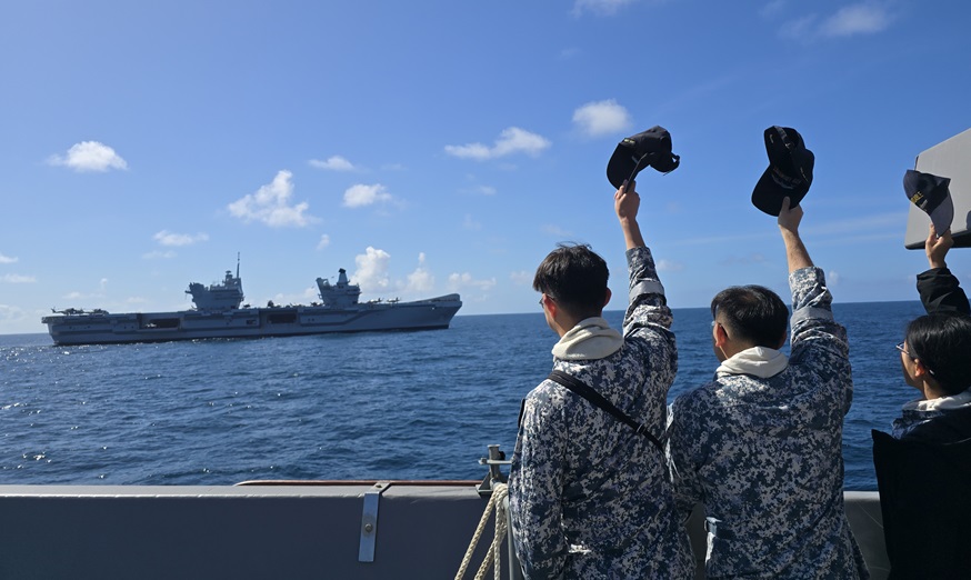 Our sailors waving to HMS Prince of Wales during the sail past as RSS Formidable makes her way to London.