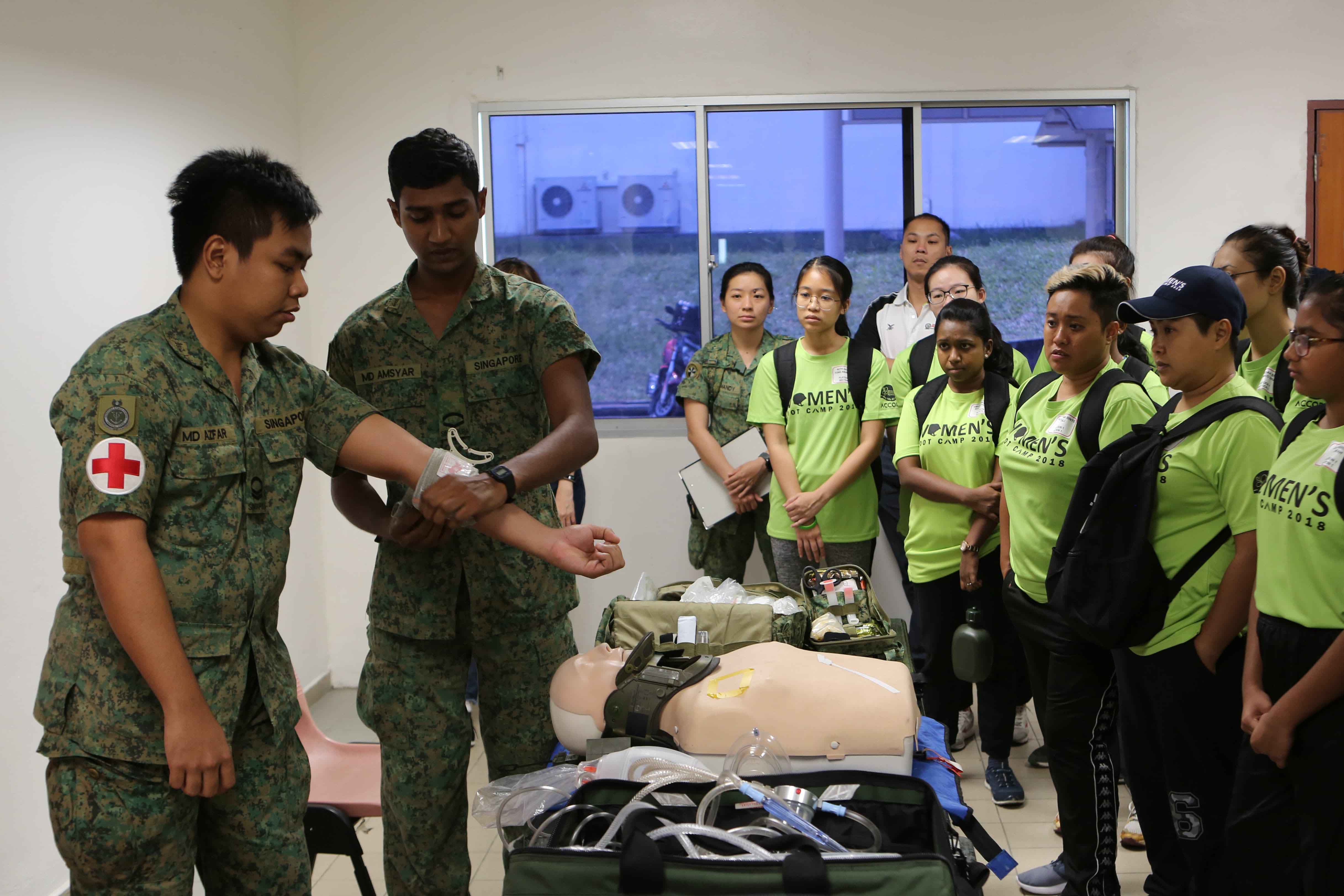 Participants being introduced to the equipment used by our medics.