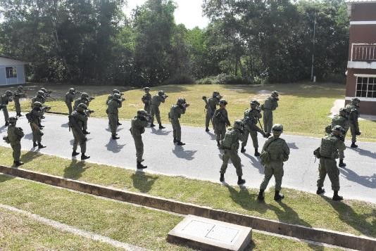 Soldiers from 3 SIR doing their warm up drills in preparation for urban operations.