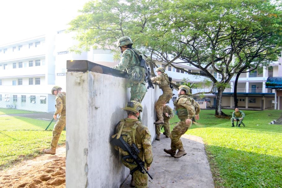 Soldiers attempting the low wall