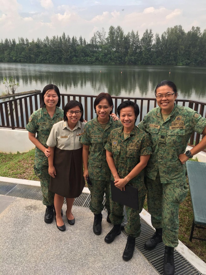 MAJ Dacialyn Koh (2nd from left), then-pregnant with her third child, with her Basic Military Training buddies.