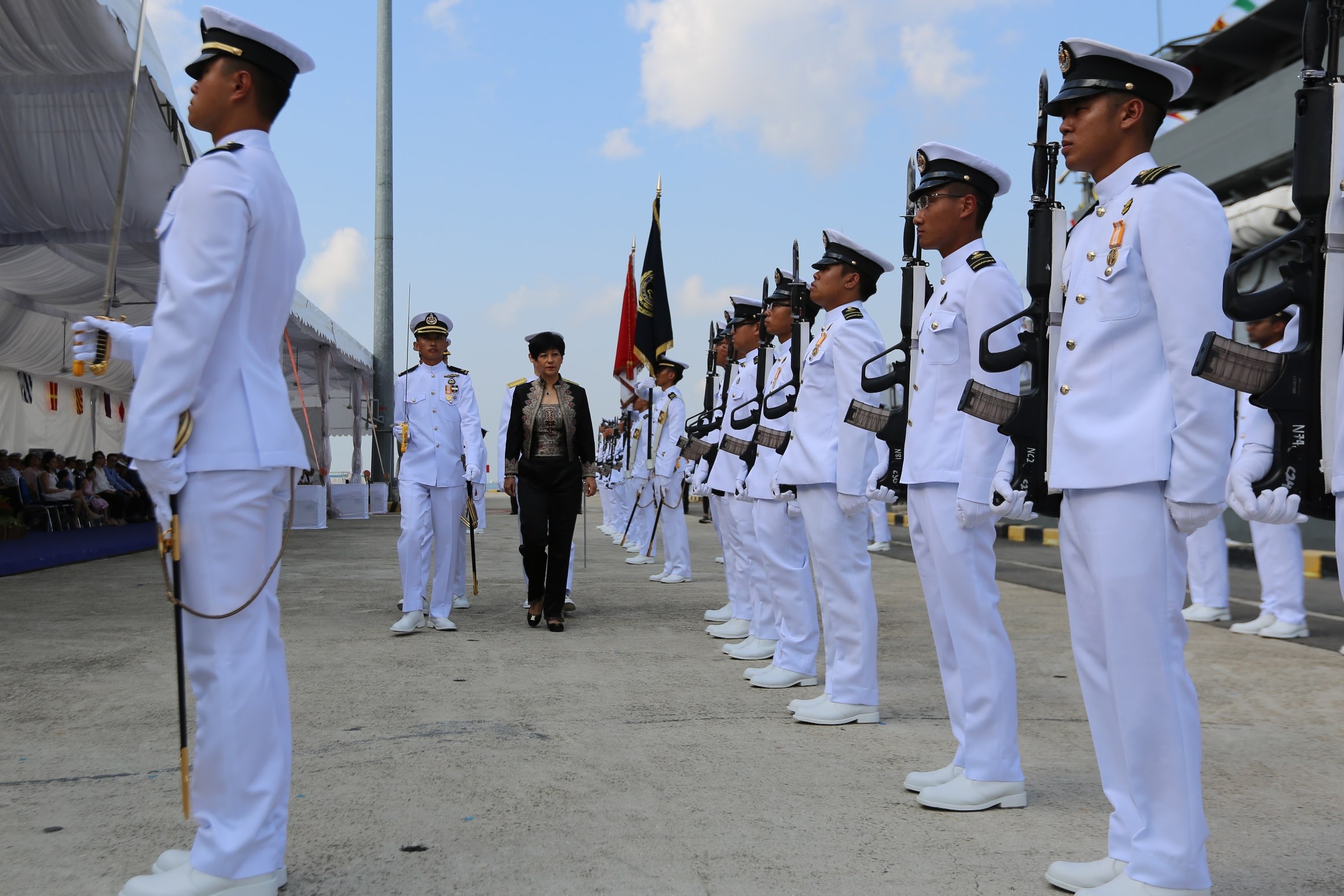 Minister in the Prime Minister's Office, Second Minister for Finance and Education Ms Indranee Rajah reviewing the Guard of Honour at the commissioning of the 4th and 5th Littoral Mission Vessels (LMVs) RSS Justice and RSS Indomitable.