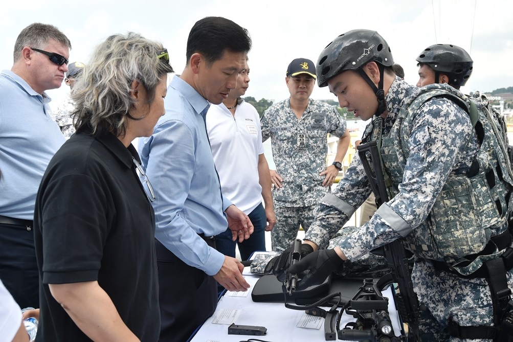 Second Minister for Defence Mr Ong Ye Kung being briefed on the equipment used by servicemen from ASSeTs.