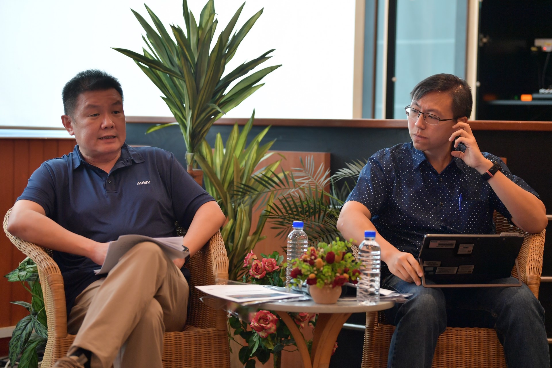 Co-chairmen of the NS55 Executive Committee Director National Service Affairs Mr Kenneth Liow (left) and Director Manpower Mr Ho Chin Ning (right) briefing the media on the year-long NS55 campaign.
