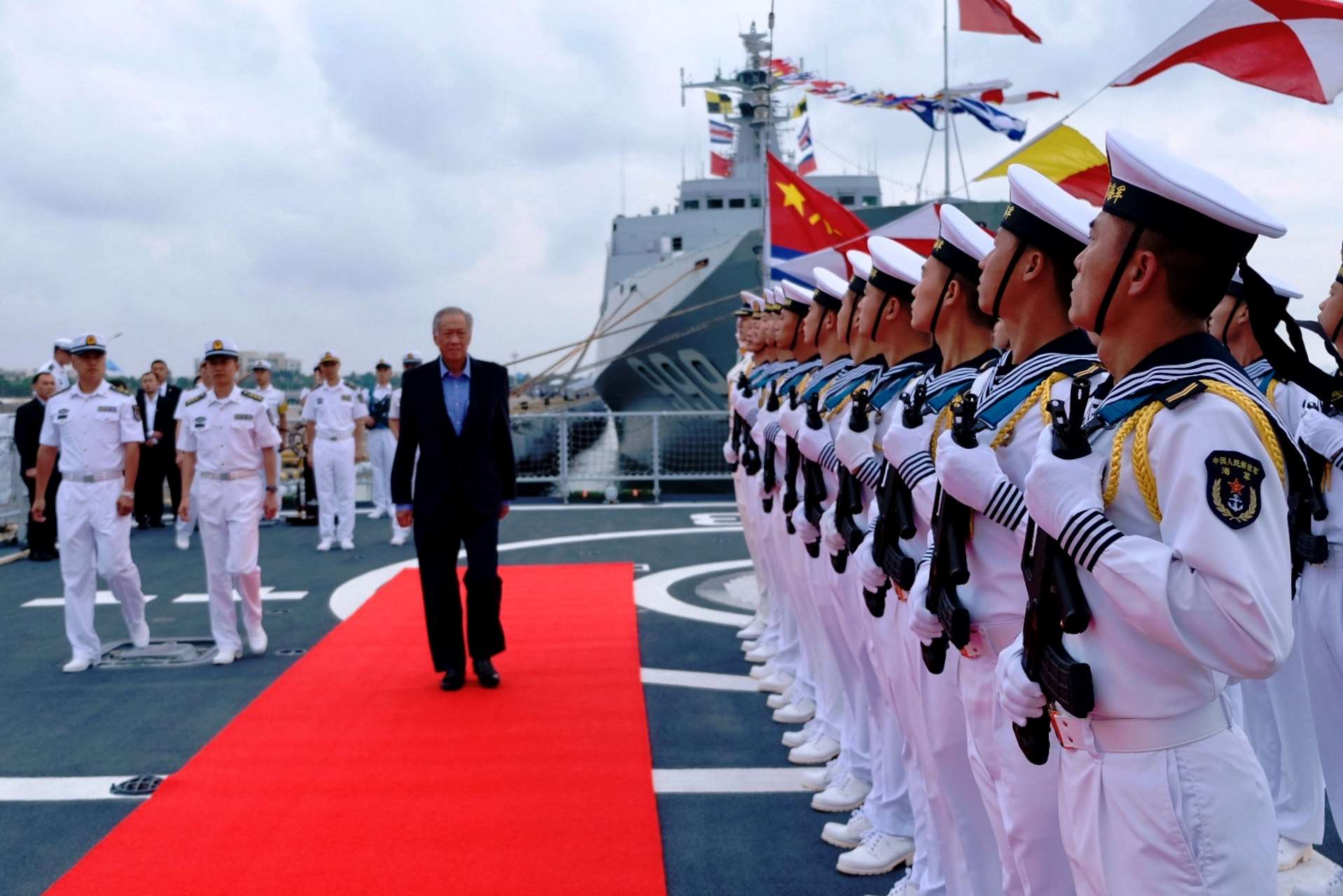 Minister for Defence Dr Ng Eng Hen reviewing an Honor Guard on board the People's Liberation Army Navy (PLAN)'s Type 052D Destroyer Changsha during his visit to the ASEAN-China Maritime Exercise in Zhanjiang today.