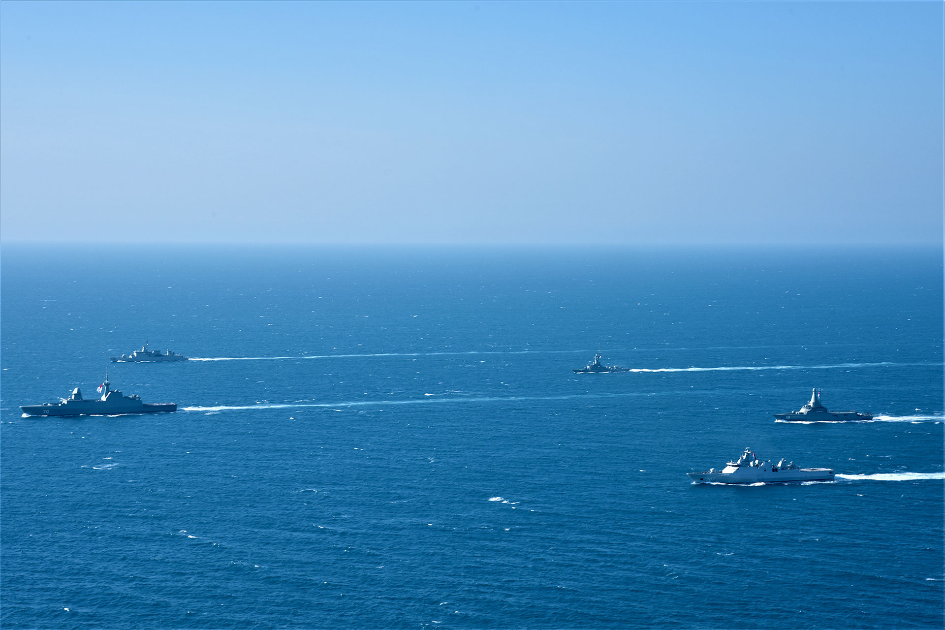 Participating ships sailing in formation during the 25th edition of Ex Eagle Indopura.