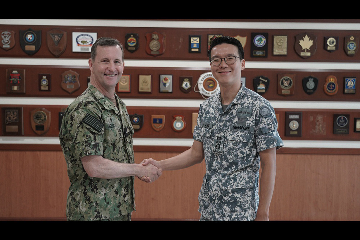 The Republic of Singapore Navy (RSN) Commander Third Flotilla Colonel (COL) Ang Jeng Kai and the United States Navy (USN) Commander Logistics Group Western Pacific Rear Admiral (RADM) Mark Melson at the Opening Ceremony.