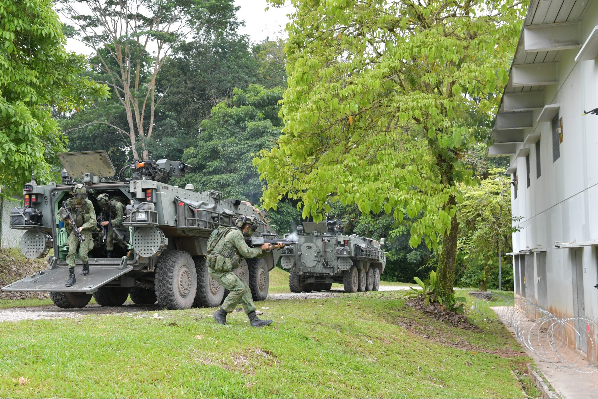 SAF personnel dismounting from a Terrex Infantry Carrier Vehicle.