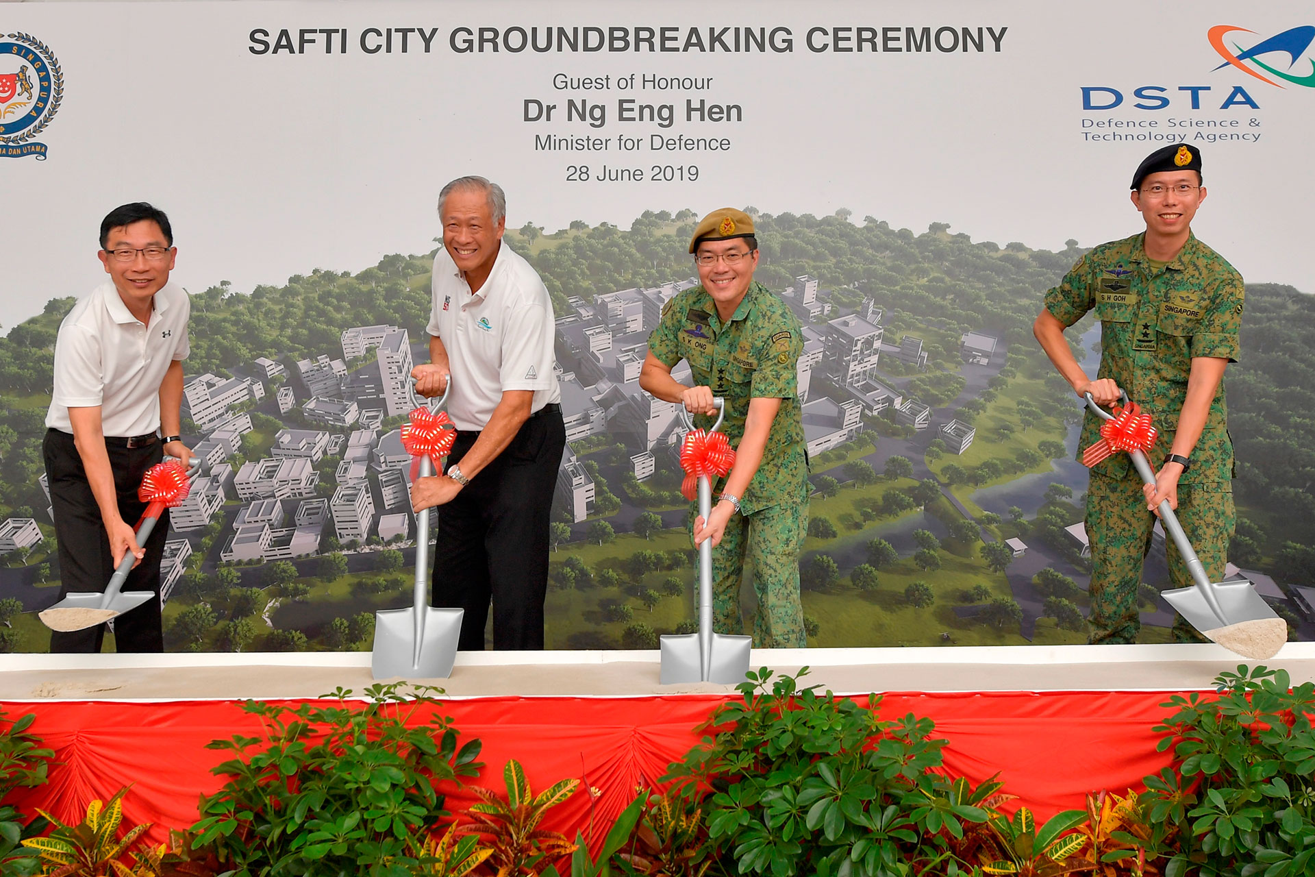 Minister for Defence Dr Ng Eng Hen (second from left) participating in the symbolic sod-turning at the SAFTI City Groundbreaking Ceremony.