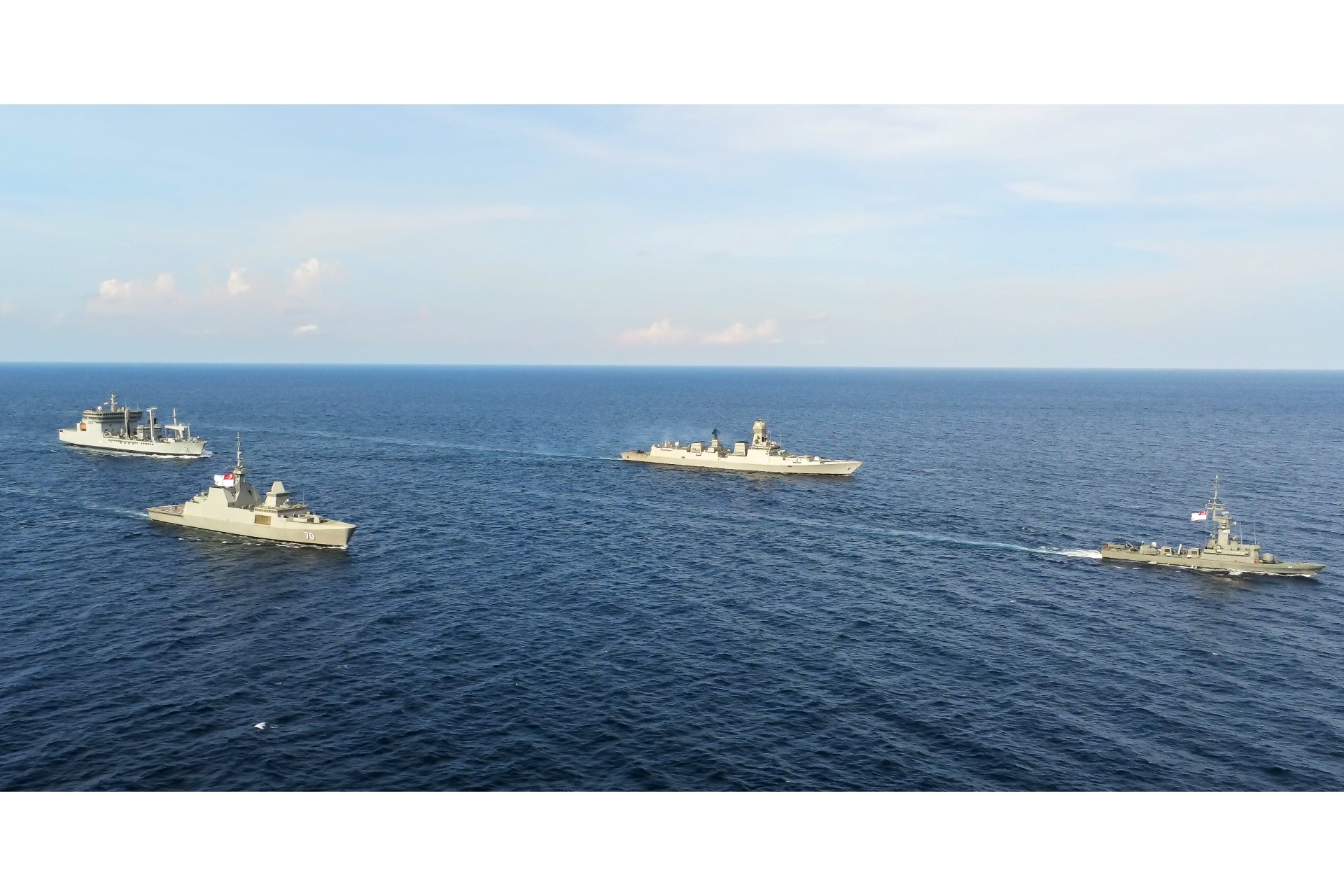 The Republic of Singapore Navy (RSN)’s missile corvette RSS Valiant and frigate RSS Steadfast sailing in formation with the Indian Navy (IN)’s destroyer INS Kolkata and oiler INS Shakti at the Singapore-India Maritime Bilateral Exercise.