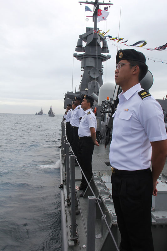 Crew of the Republic of Singapore Navy's Victory-class Missile Corvette RSS Valiant on deck as they prepare for the review by Thailand's Prime Minister General Prayut Chan-o-cha during the International Fleet Review.