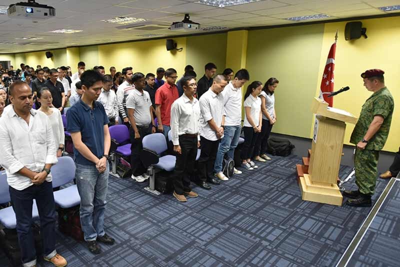 SVs observing a minute of silence as a mark of respect for Mr Lee Kuan Yew during enlistment.