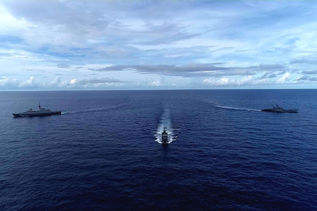Vessels from the Republic of Singapore Navy (RSN) (left), Indian Navy (IN) (right) and Royal Thai Navy (RTN) (middle) conducting manoeuvring drills in the Andaman Sea during the third Singapore-India-Thailand Maritime Exercise (SITMEX) 2021.