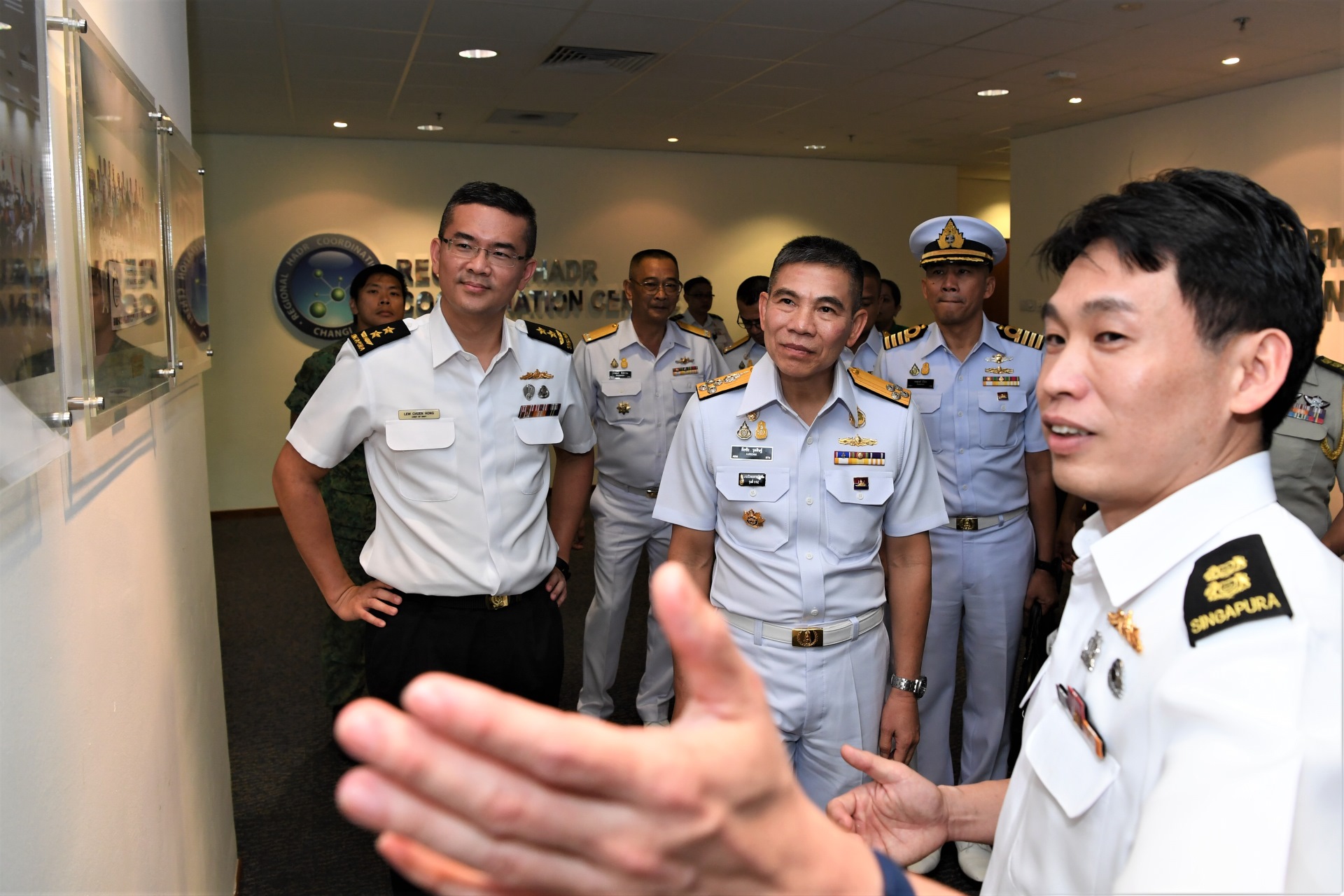 ADM Luechai (second from left), accompanied by Chief of Navy Rear-Admiral Lew Chuen Hong (left), receiving a brief at the Information Fusion Centre at RSS Singapura - Changi Naval Base this afternoon.