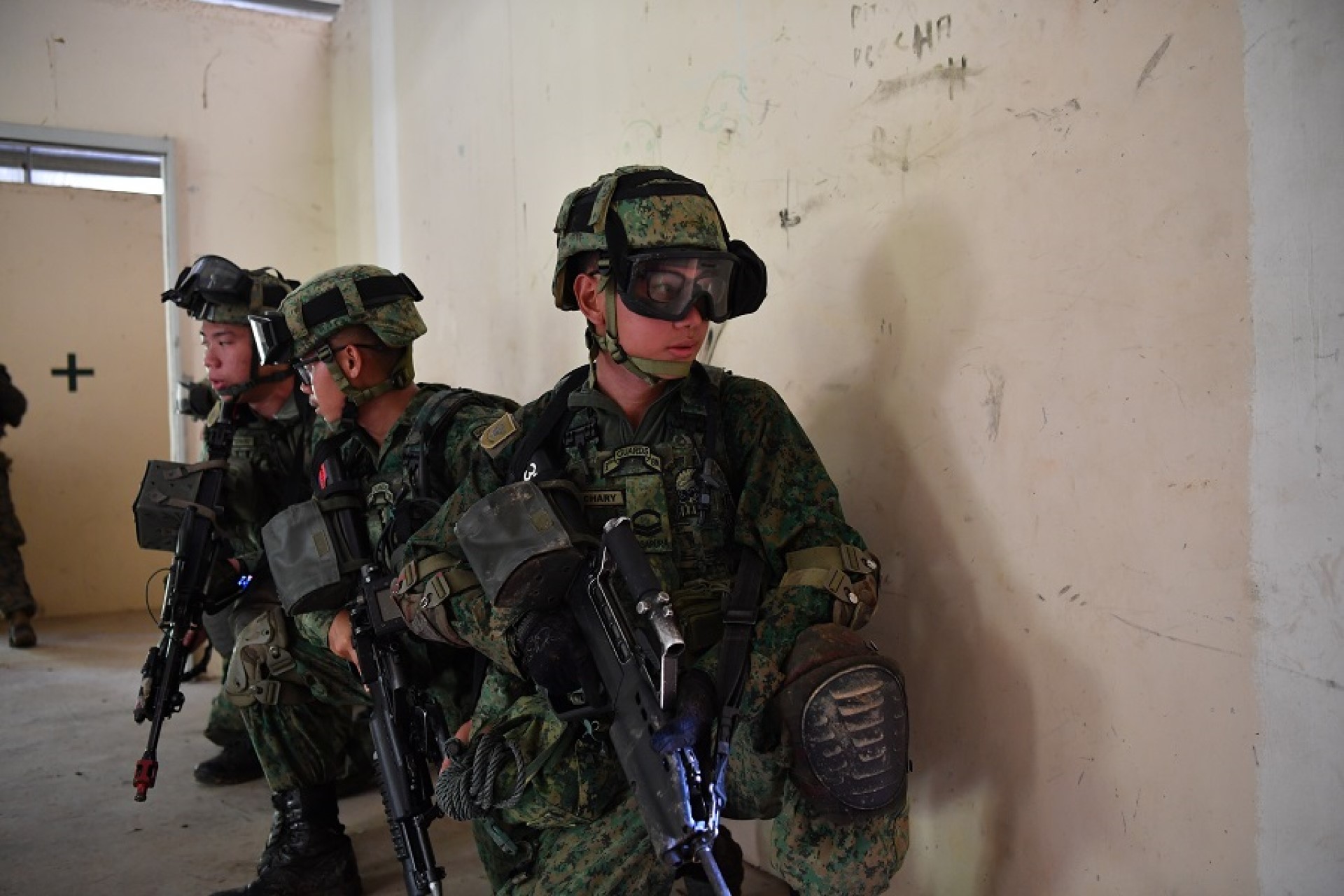 SAF personnel executing a Urban Operations (UO) drill during UO training.