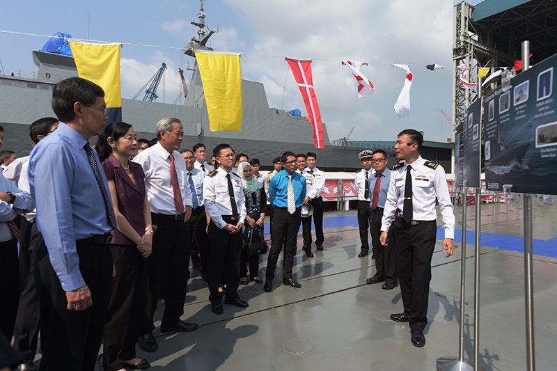 (From left) Second Minister for Defence Mr Lui Tuck Yew, Mrs Ng, Dr Ng, Chief of Navy Rear-Admiral Lai Chung Han, Mrs Maliki, and Minister of State for Defence Dr Mohamad Maliki Bin Osman being briefed about the LMV on its deck. 
