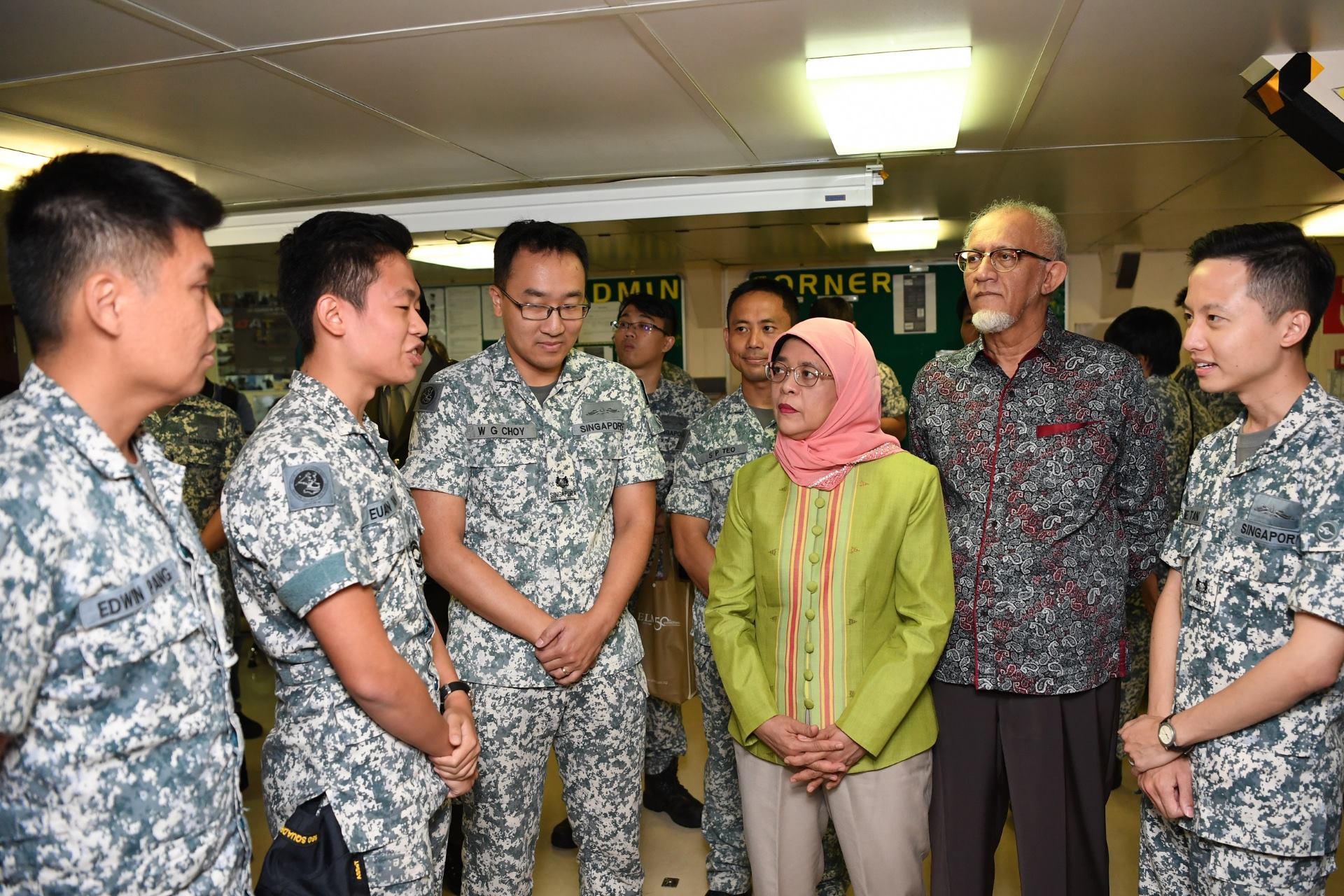 Madam Halimah interacting with RSN personnel on board RSS <i>Endeavour</i>.