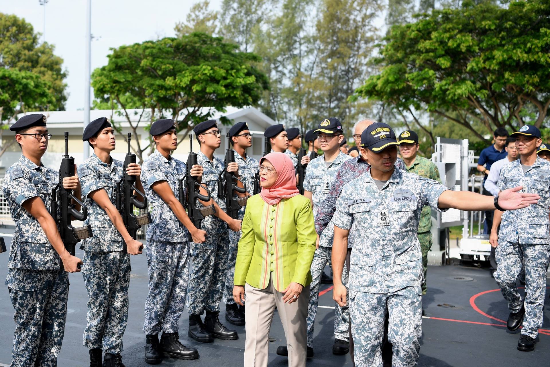 President Halimah Yacob inspecting a Line of Honour as she boards the Republic of Singapore Navy's (RSN) RSS <i>Endeavour</i>,