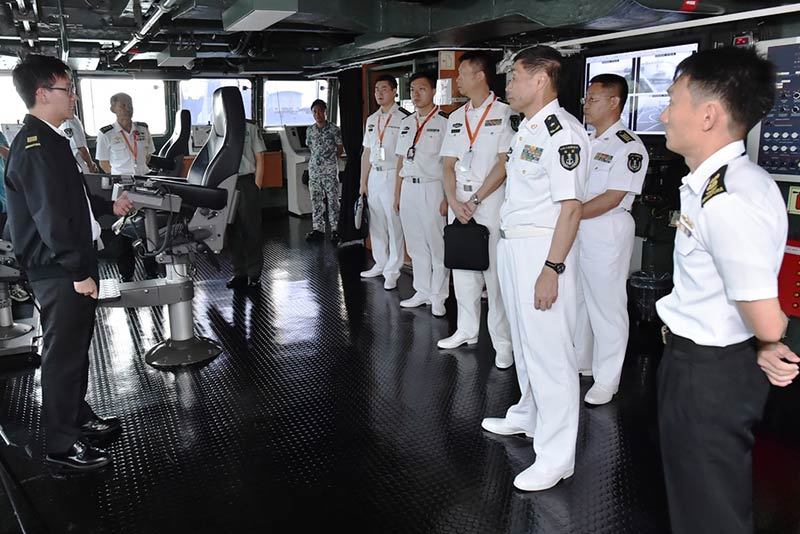 RADM Shen and other PLA(N) officers being briefed on the RSN's Formidable-class Frigate during their visit to RSS Intrepid.