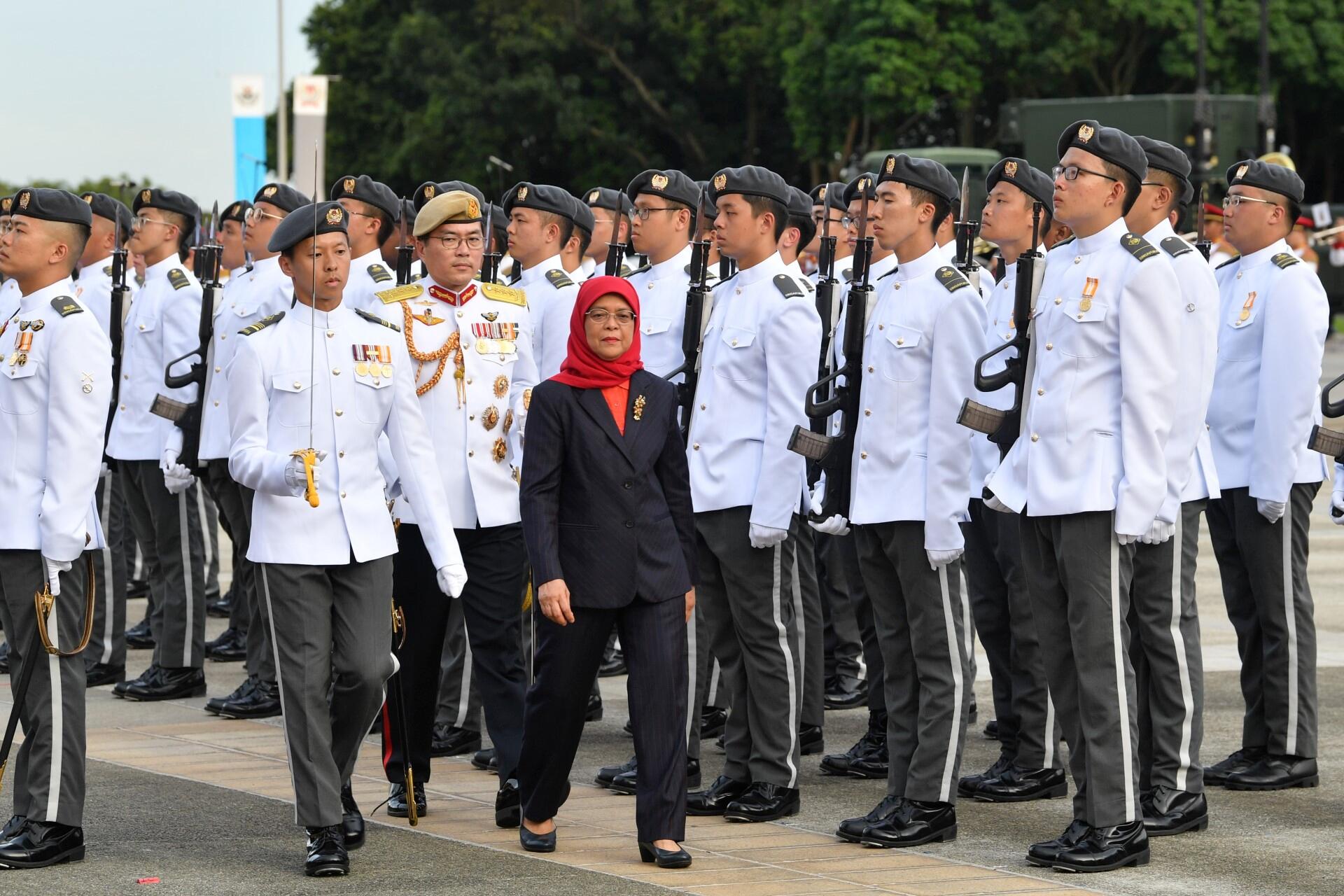 President Halimah Yacob inspecting the Digital and Intelligence Service (DIS) contingents at the DIS Inauguration Parade held at SATI Military Institute (SAFTI MI) this evening.