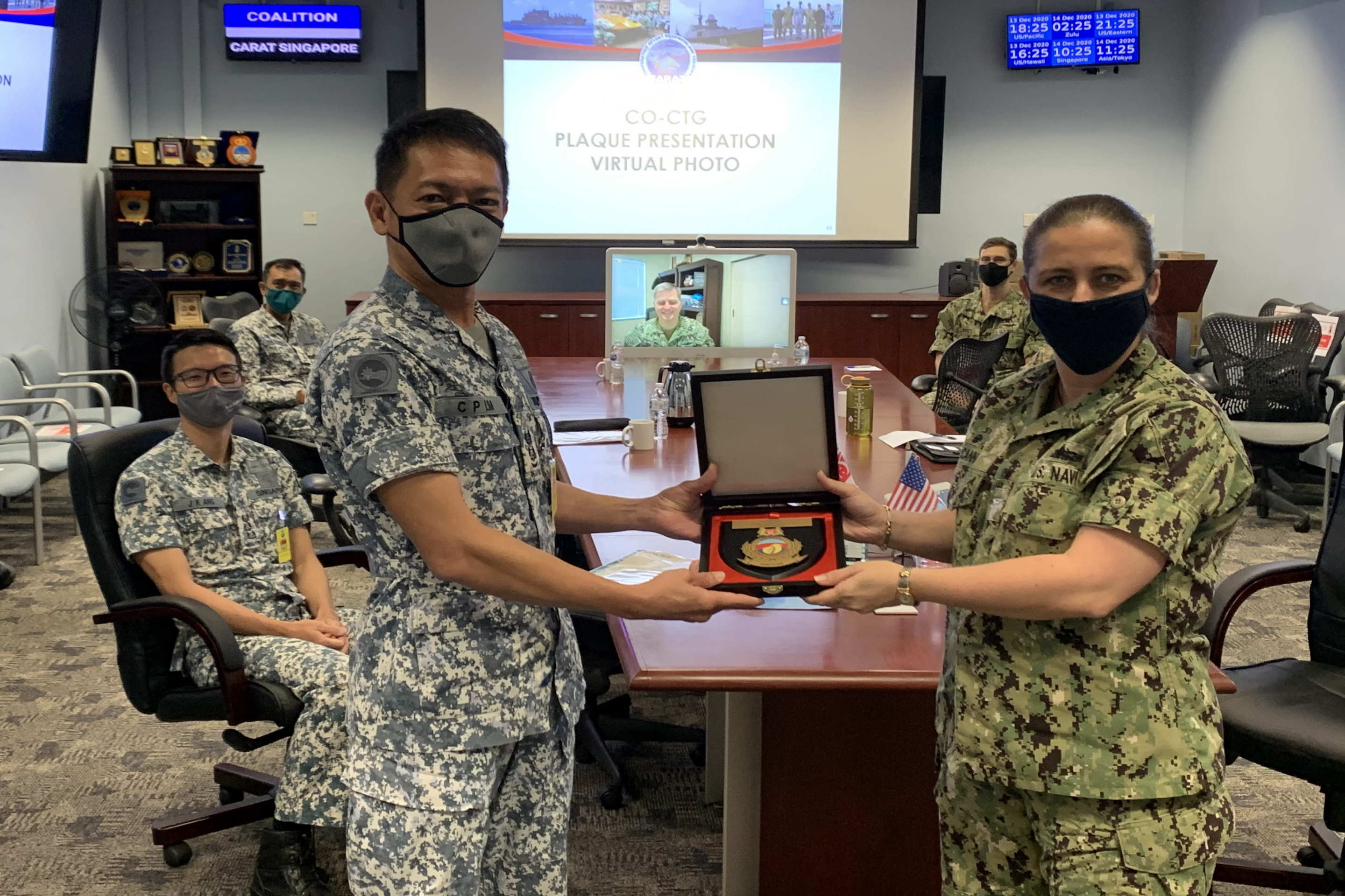 Presentation of plaque by RSN Senior Lieutenant-Colonel (SLTC) Lim CHee Peng, Deputy Commander 3rd Flotilla to USN Captain (CAPT) Ann McCann, Commodore Destroyer Squadron 7 at the closing ceremony of Exercise CARAT 2020 earlier today.
