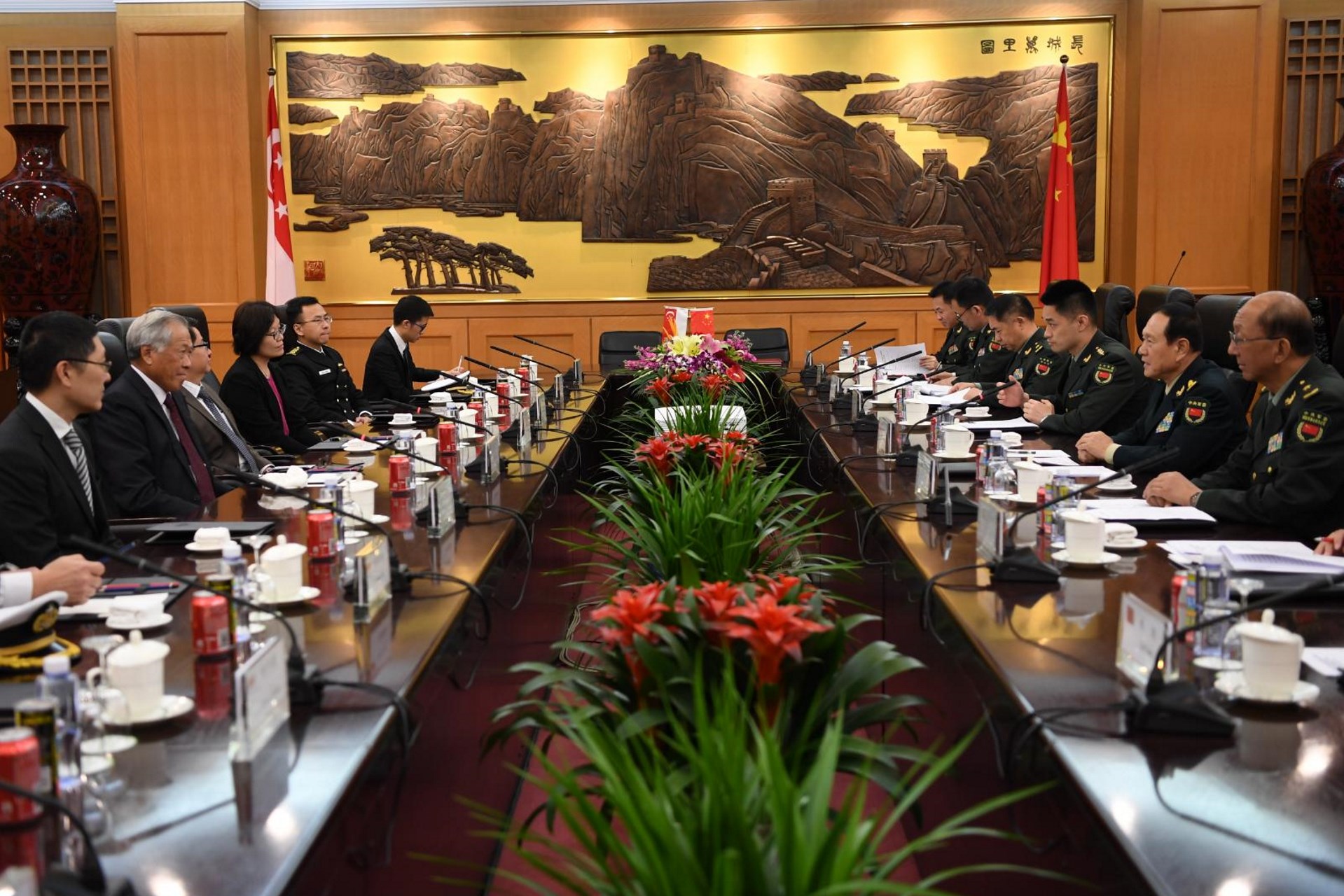 Dr Ng (second from left) and GEN Wei (second from right) during the meeting at Bayi Building in Beijing, China this morning.