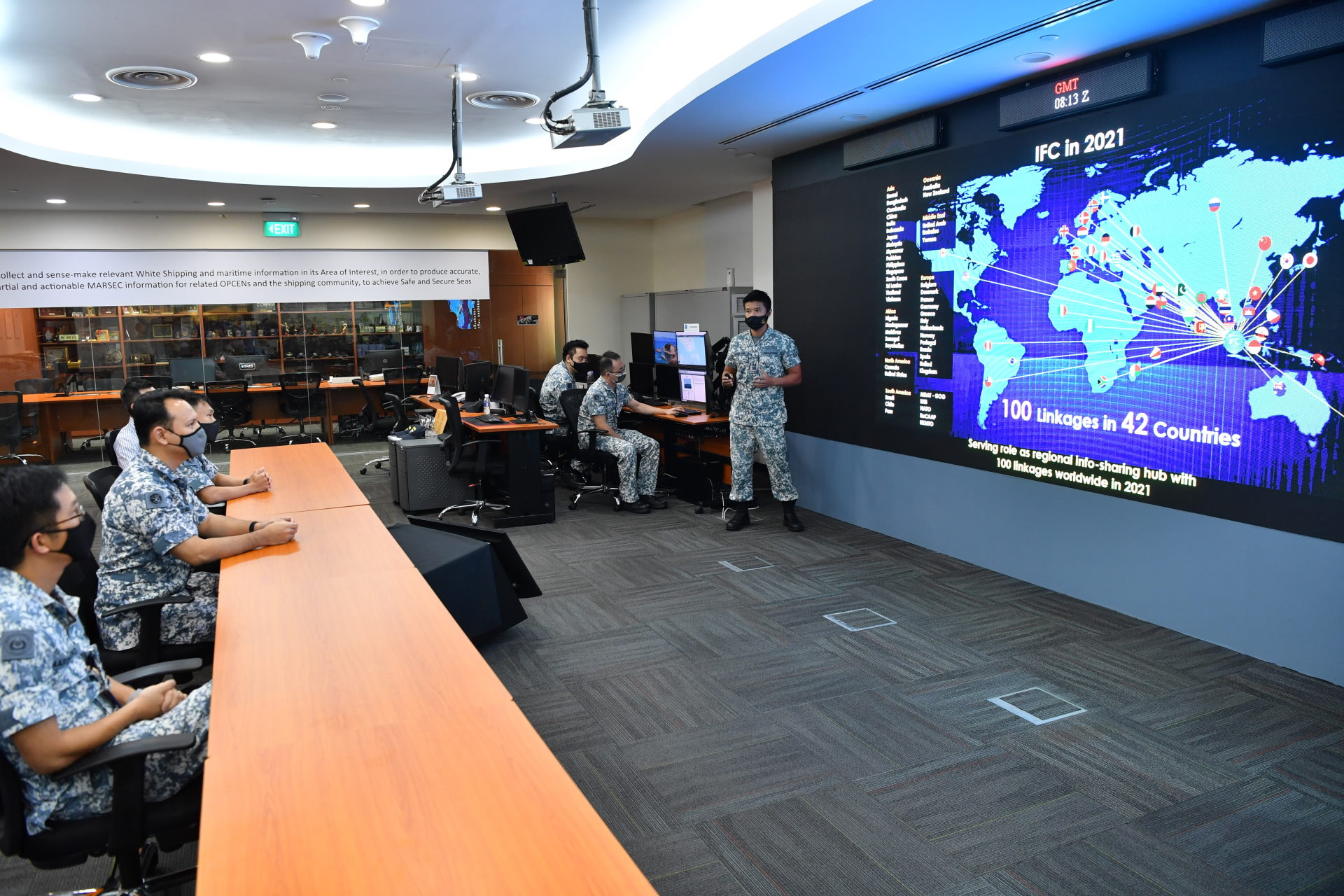 Senior Minister of State for Defence Mr Zaqy Mohamad (second from left) receiving a briefing from Head Information Fusion Centre, LTC Lester Yong (centre) during his visit to Maritime Security Task Force (MSTF)/MARSEC Command. 