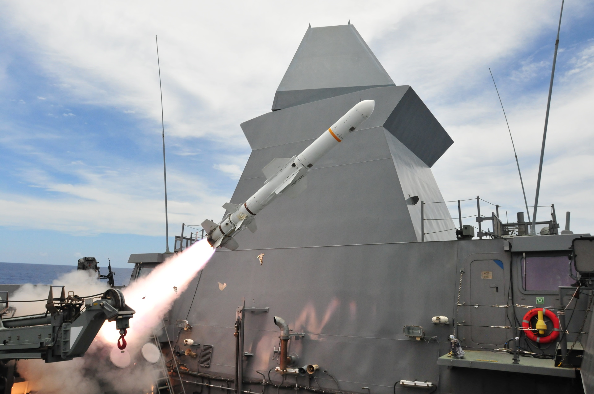 The Republic of Singapore Navy (RSN) frigate RSS Tenacious firing a harpoon anti-ship missile during a coordinated strike with RSS Stalwart and the RSAF fighters, in the waters off Guam during Exercise Pacific Griffin 2021 (XPG21).