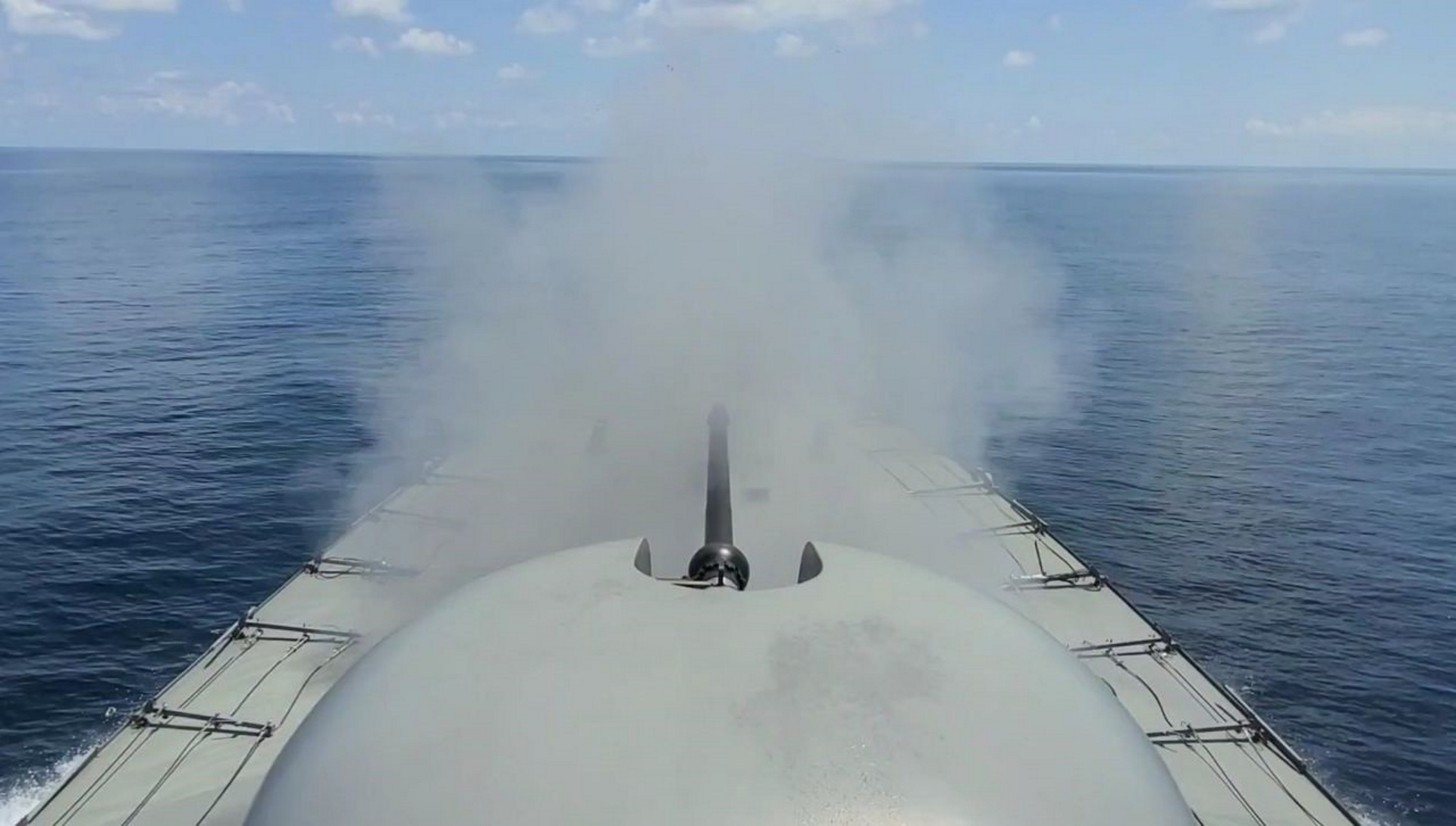 RSS Vigilance firing its A-Gun at a simulated surface target during a gunnery exercise