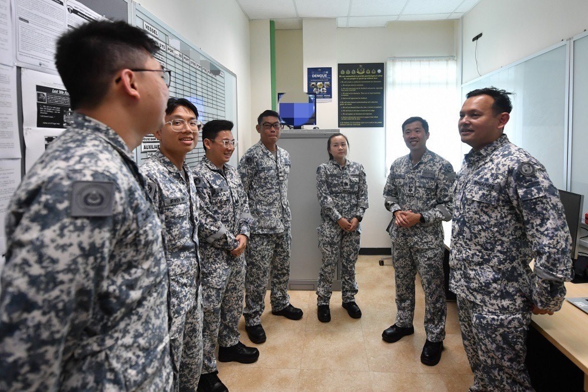 Mr Zaqy (right) engaging RSN personnel, including Full-time National Servicemen from the USV Squadron.
