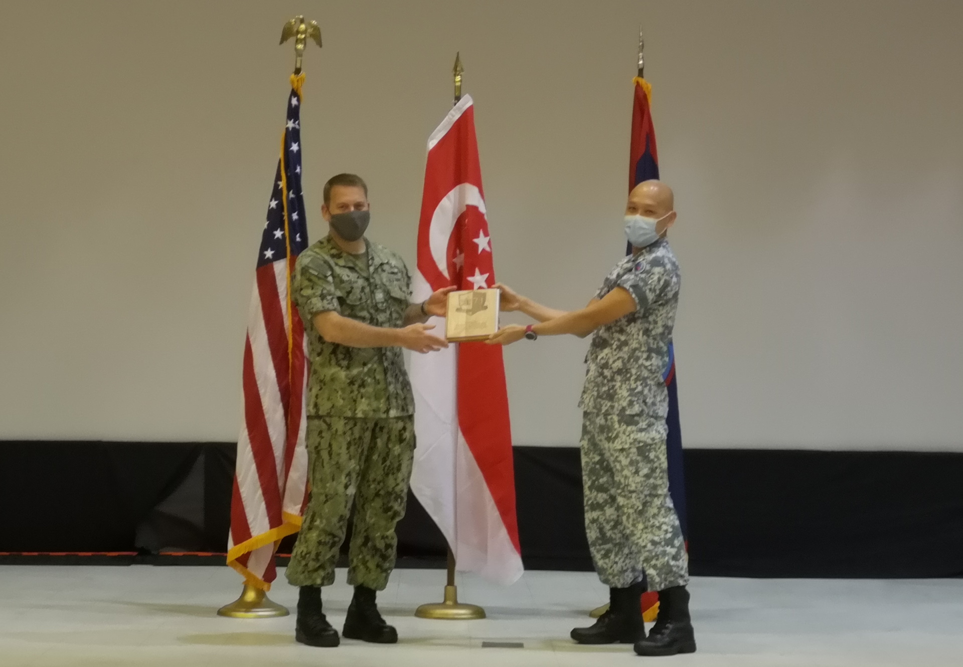The RSN's Deputy Fleet Commander and exercise task force commander, Colonel Ooi Tjin Kai (right) and the USN's Commander Task Force 71, Captain Chase Sargeant (left) officiating at the opening ceremony of XPG21.