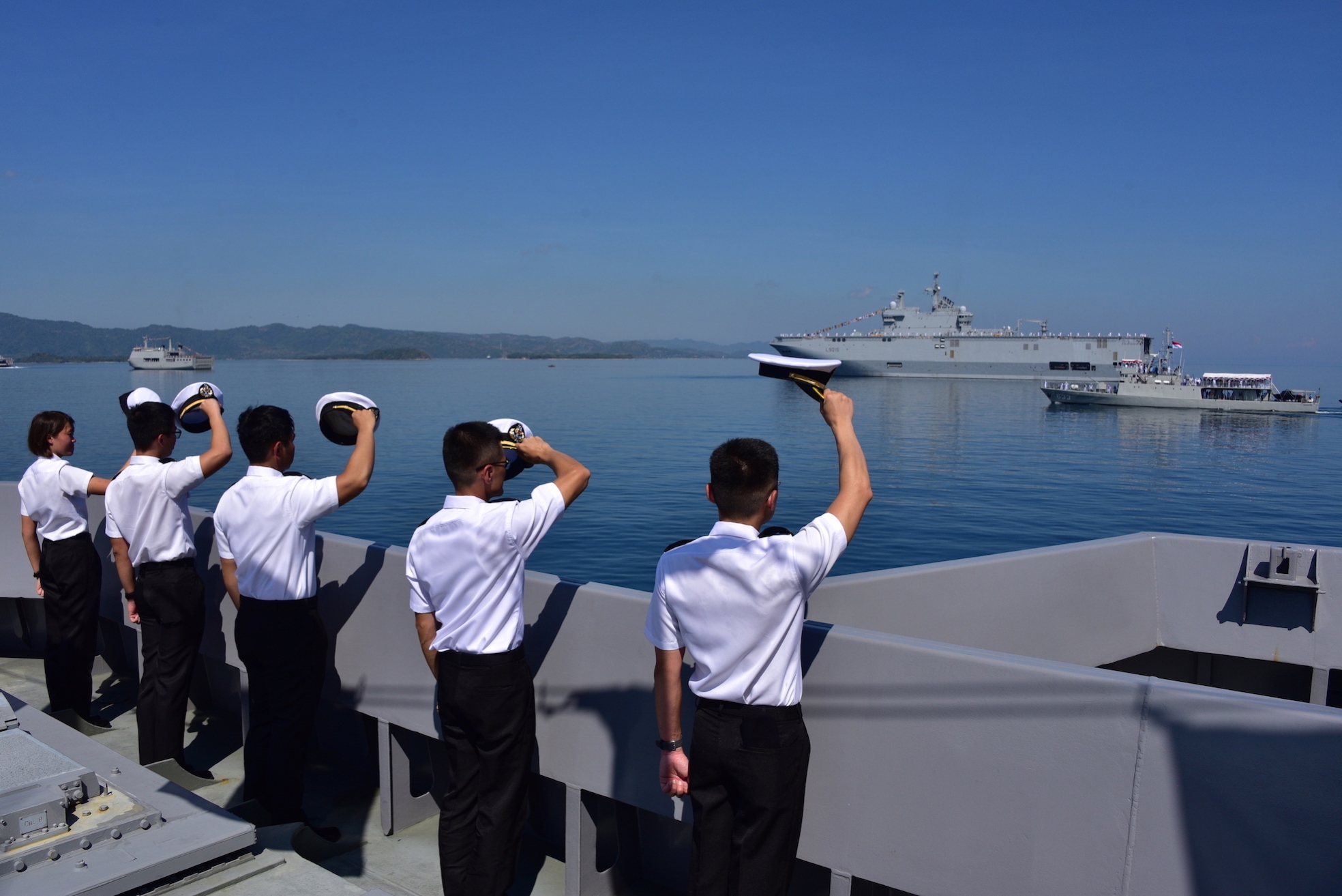 Crew from RSS Formidable lining up on deck as Indonesian Navy (TNI AL) Chief of Staff Admiral Ade Supandi conducts the International Fleet Review on board KRI Barakuda (first from right).