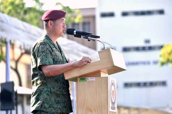 COL Tan delivering his speech at the Beret Presentation Parade.