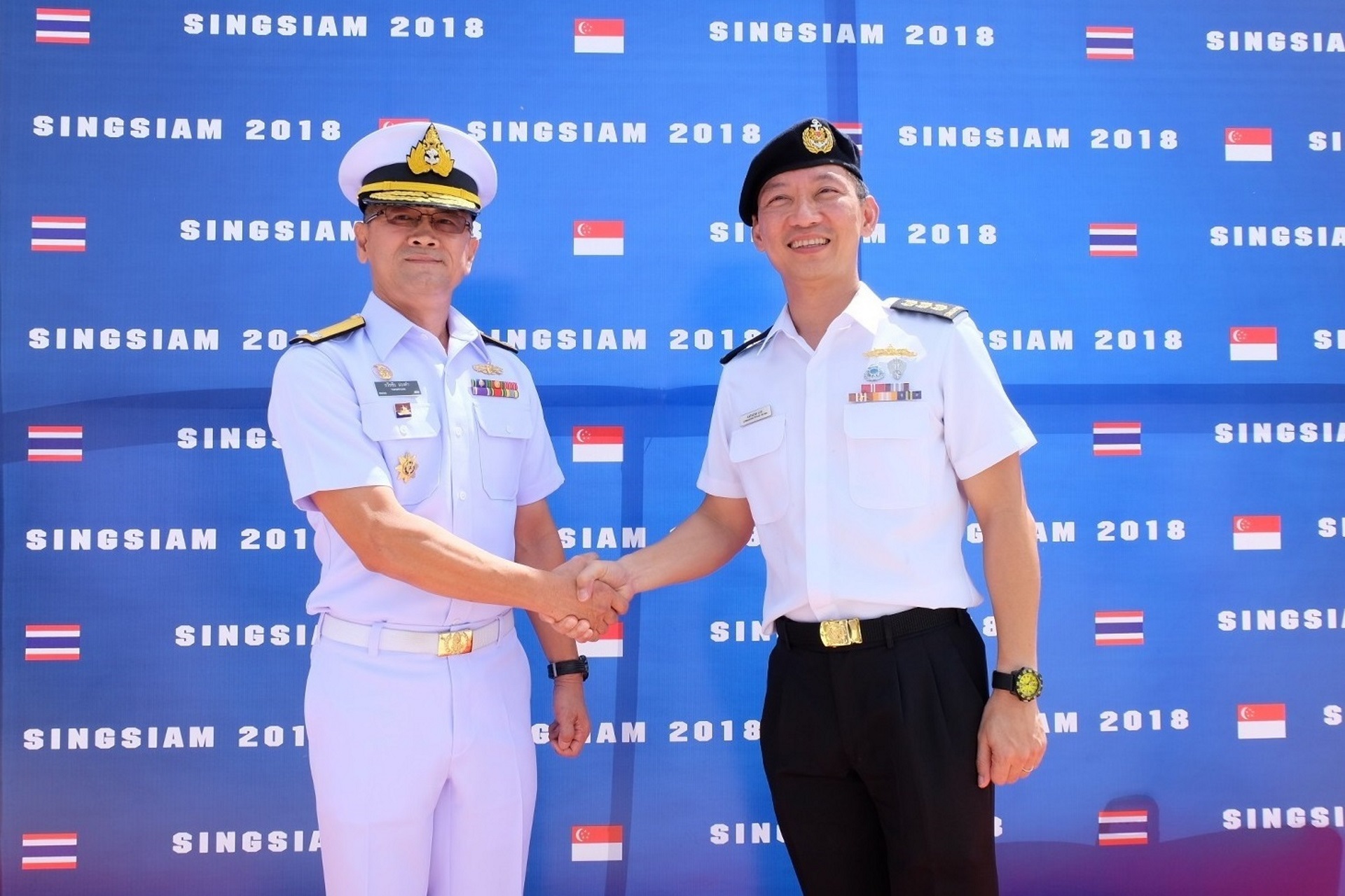 Commanding Officer of the RSN's 188 Squadron, Colonel (COL) Anthony Lee, officiating at Exercise Singsiam 2018's opening ceremony with Commanding Officer of the RTN's Frigate Squadron 2, Rear-Admiral Tawatchai Mwngkham.
