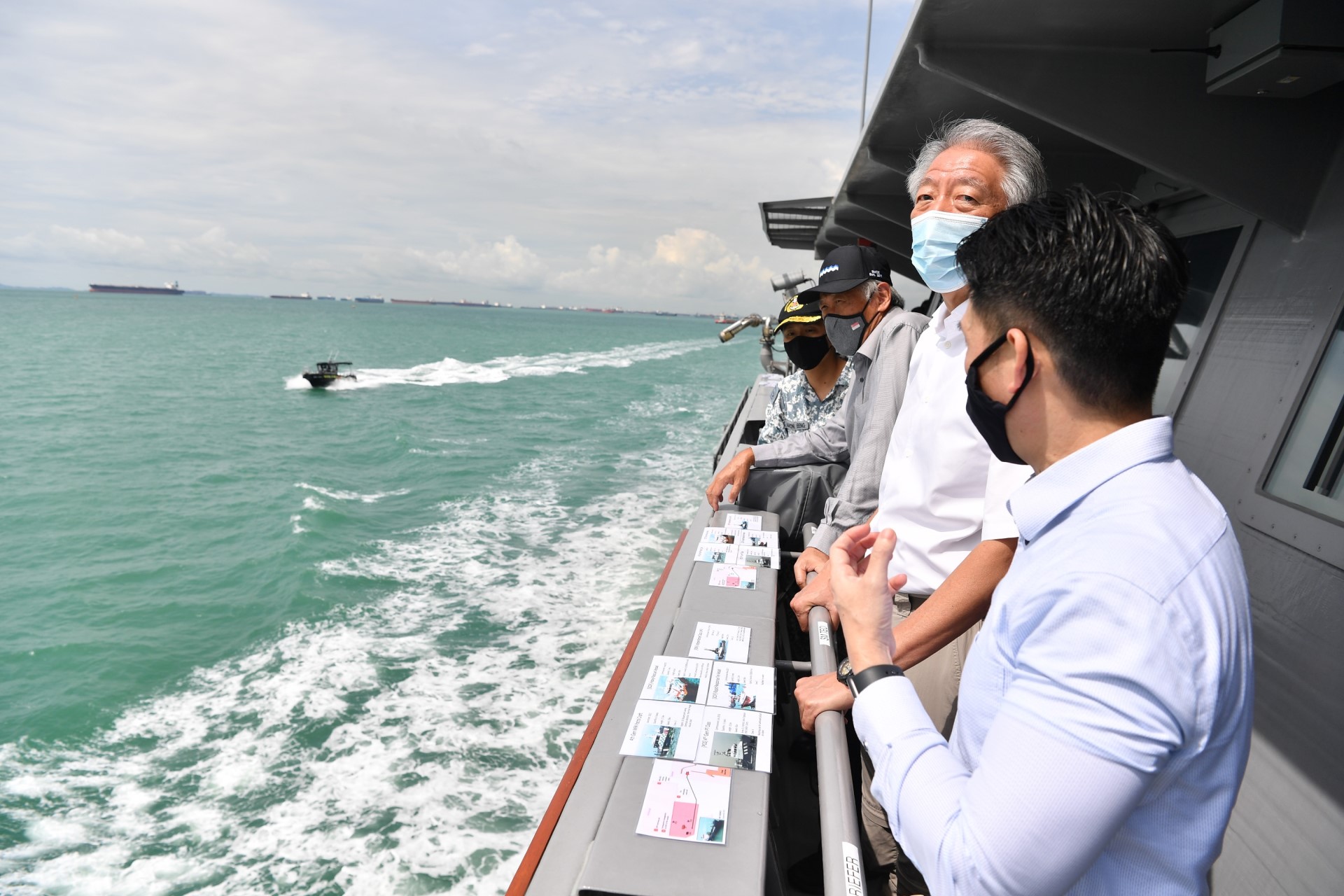 Senior Minister and Coordinating Minister for National Security Mr Teo Chee Hean (second from right), accompanied by Minister for Defence Dr Ng Eng Hen (second from left) witnessing a sea demonstration on RSS Fortitude