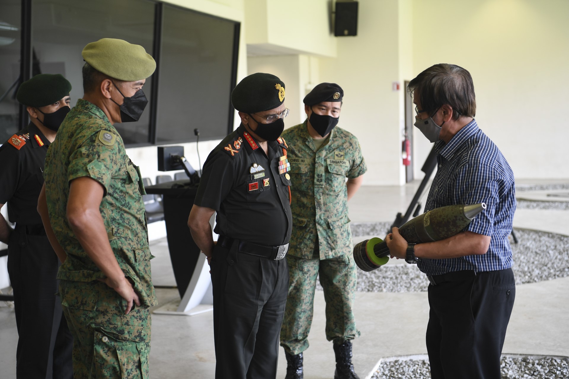 GEN Naravane (middle) receiving a brief at the Infantry Gunnery and Tactical Simulator this afternoon.