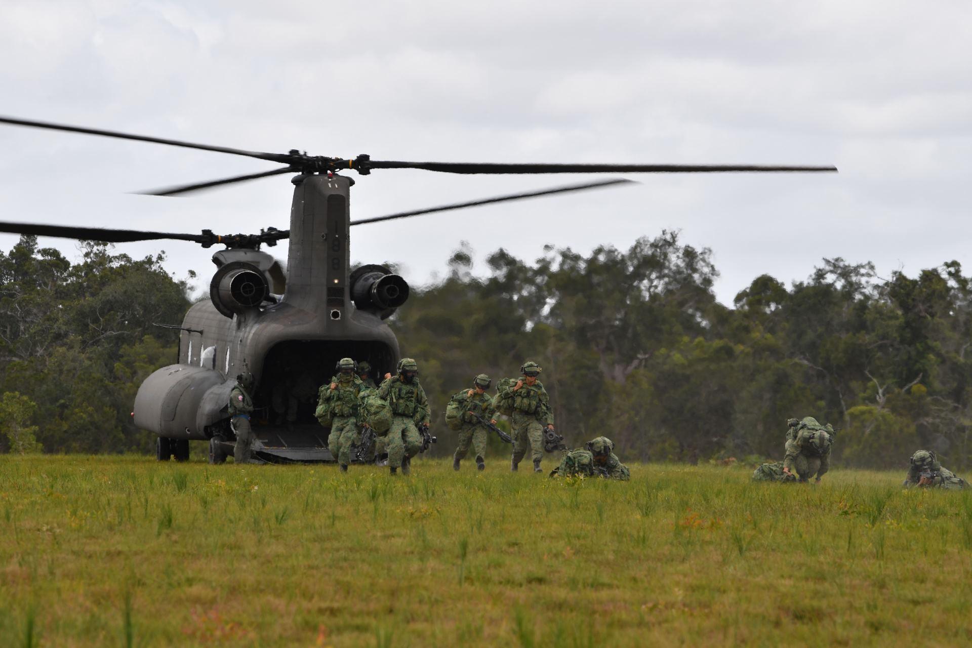 Exercise troops disembarking from the Chinook helicopter during a troop insertion mission during Exercise Trident.